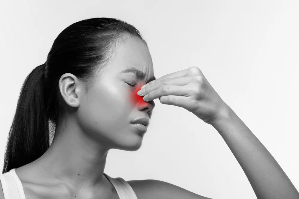 Female patient experiencing persistent sinus problems